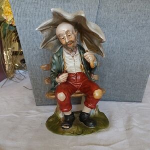 Vintage Capodimonte porcelain figurine of a seated Old man